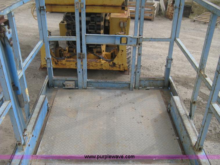 image for item B8300 2003 Genie GS-3268RT rough terrain scissor lift