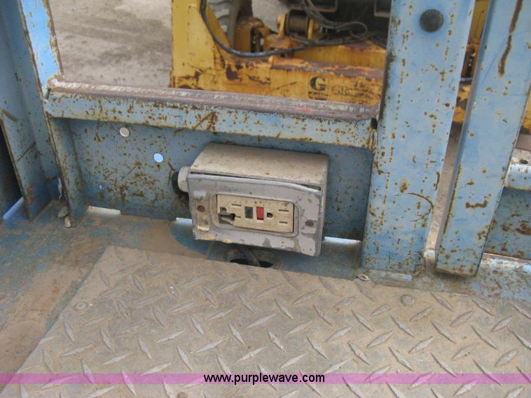 image for item B8300 2003 Genie GS-3268RT rough terrain scissor lift