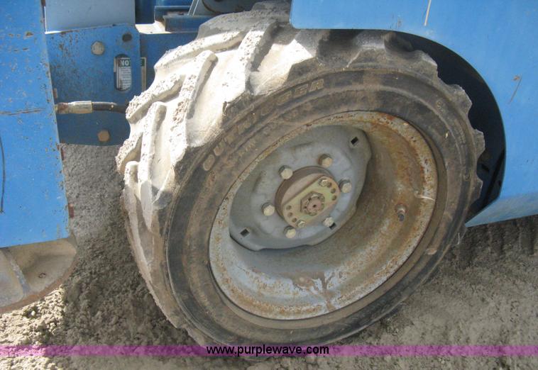 image for item B8300 2003 Genie GS-3268RT rough terrain scissor lift