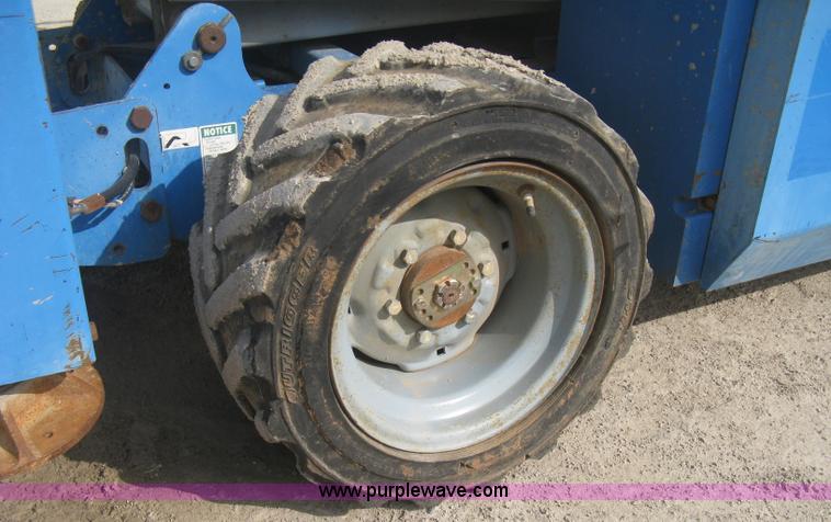 image for item B8300 2003 Genie GS-3268RT rough terrain scissor lift