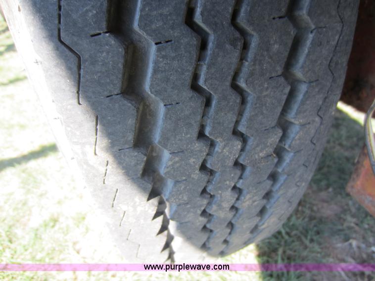 image for item F6518 1982 Chief 17'L x 84"W backhoe trailer