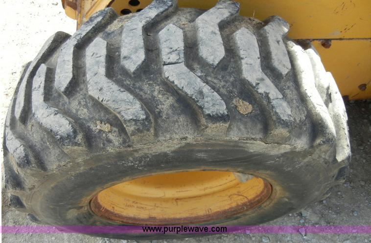 image for item F7503 2002 John Deere 250 skid steer