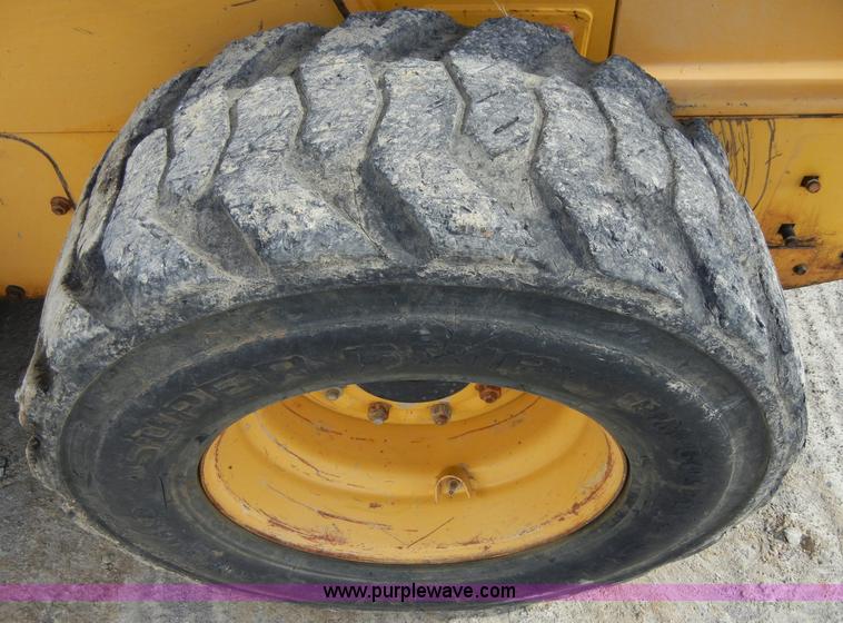 image for item F7503 2002 John Deere 250 skid steer