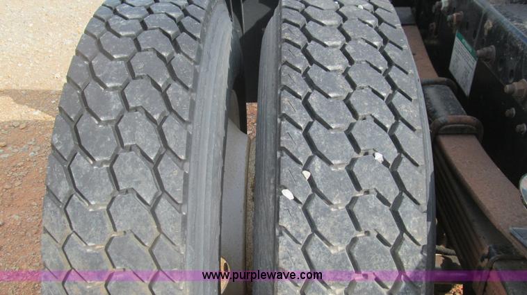 image for item F3054 1997 Freightliner FL70 semi truck