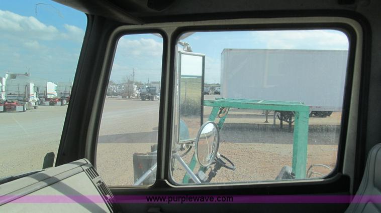 image for item F3054 1997 Freightliner FL70 semi truck