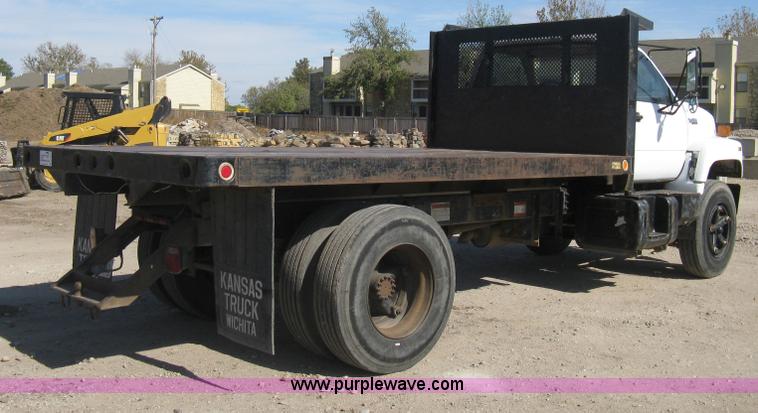 image for item B8272 1991 GMC TopKick SLE flatbed dump truck