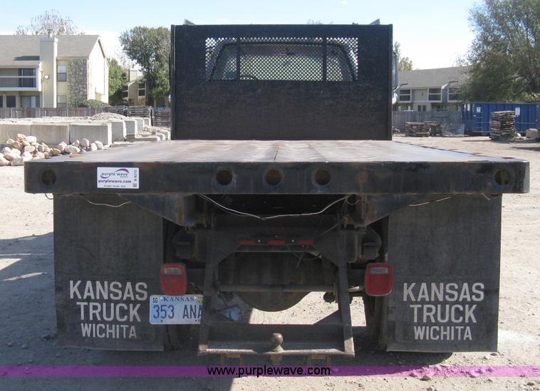 image for item B8272 1991 GMC TopKick SLE flatbed dump truck