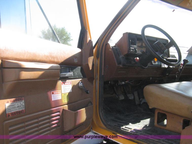 image for item B8272 1991 GMC TopKick SLE flatbed dump truck