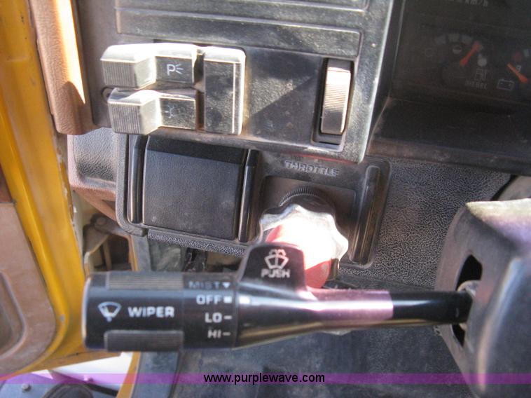 image for item B8272 1991 GMC TopKick SLE flatbed dump truck