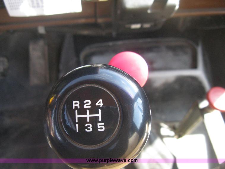 image for item B8272 1991 GMC TopKick SLE flatbed dump truck