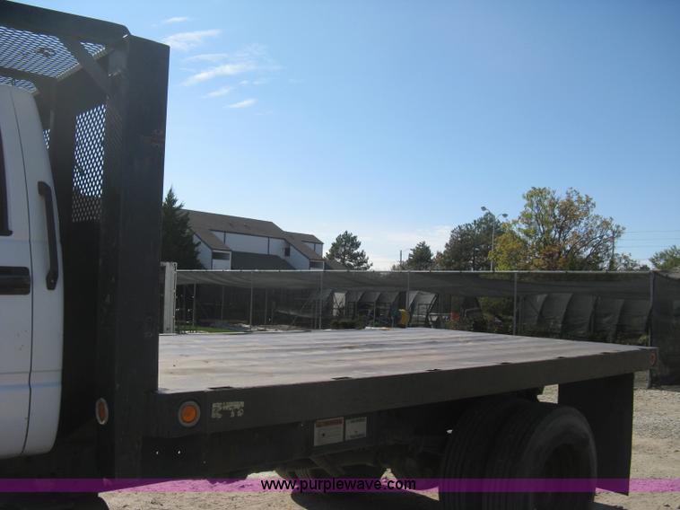 image for item B8272 1991 GMC TopKick SLE flatbed dump truck