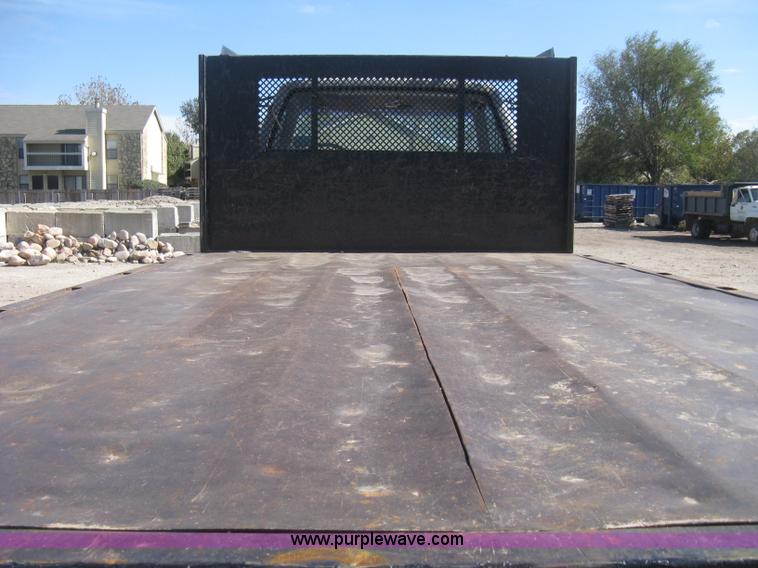 image for item B8272 1991 GMC TopKick SLE flatbed dump truck