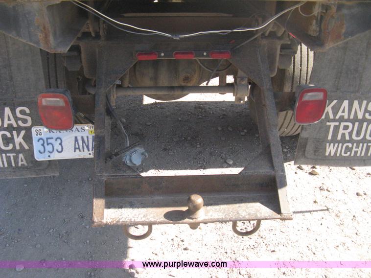 image for item B8272 1991 GMC TopKick SLE flatbed dump truck