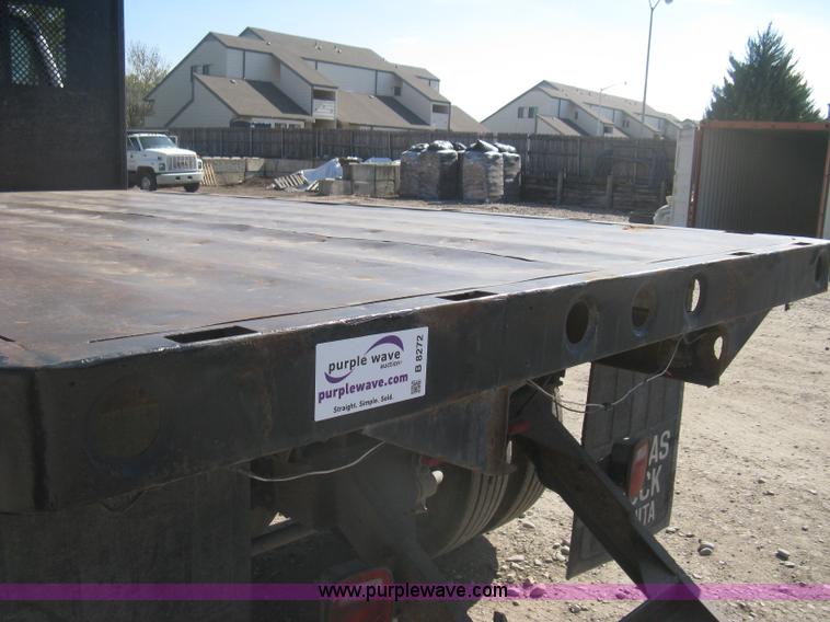 image for item B8272 1991 GMC TopKick SLE flatbed dump truck