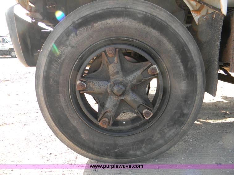 image for item B8272 1991 GMC TopKick SLE flatbed dump truck