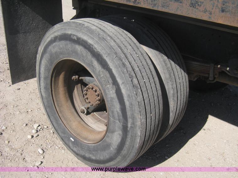 image for item B8272 1991 GMC TopKick SLE flatbed dump truck