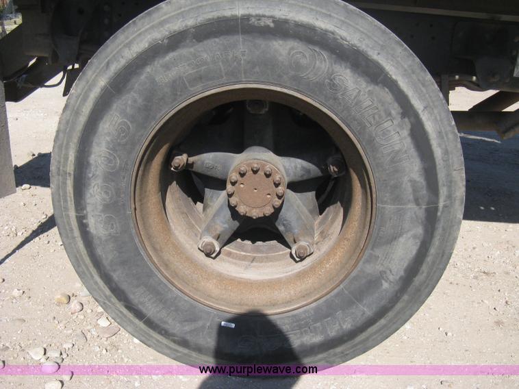 image for item B8272 1991 GMC TopKick SLE flatbed dump truck