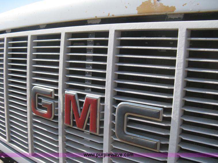 image for item B8272 1991 GMC TopKick SLE flatbed dump truck