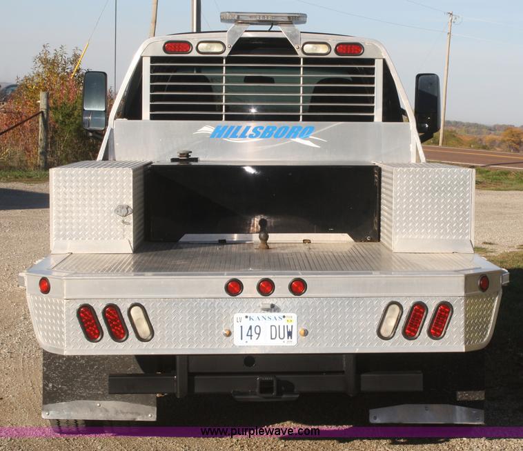 image for item F2692 2006 GMC C5500 Crew Cab flatbed truck