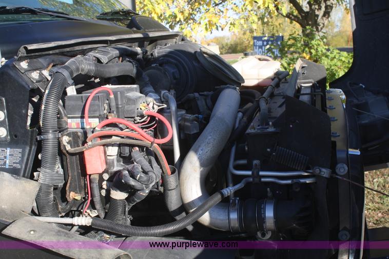 image for item F2692 2006 GMC C5500 Crew Cab flatbed truck