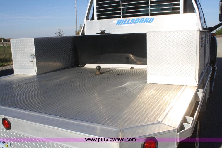 image for item F2692 2006 GMC C5500 Crew Cab flatbed truck