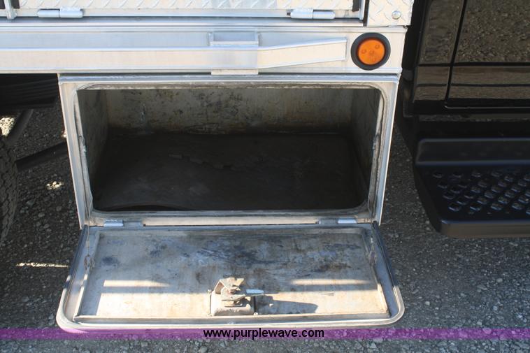 image for item F2692 2006 GMC C5500 Crew Cab flatbed truck