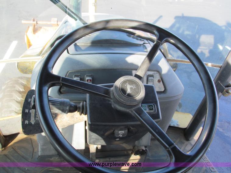 image for item E5643 2003 John Deere 410G backhoe