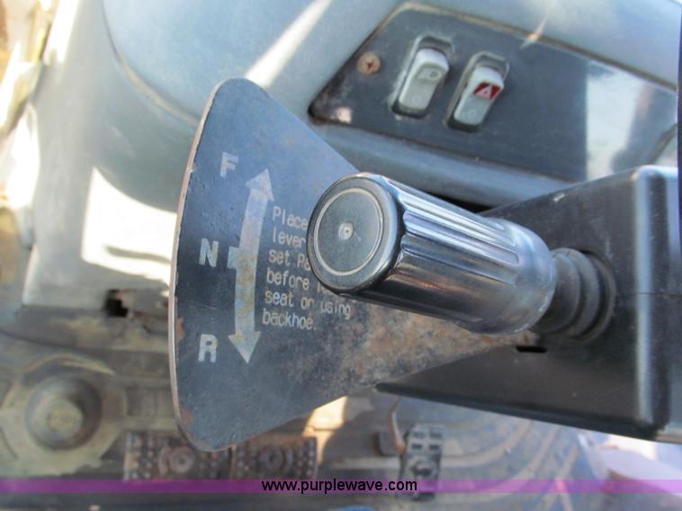 image for item E5643 2003 John Deere 410G backhoe