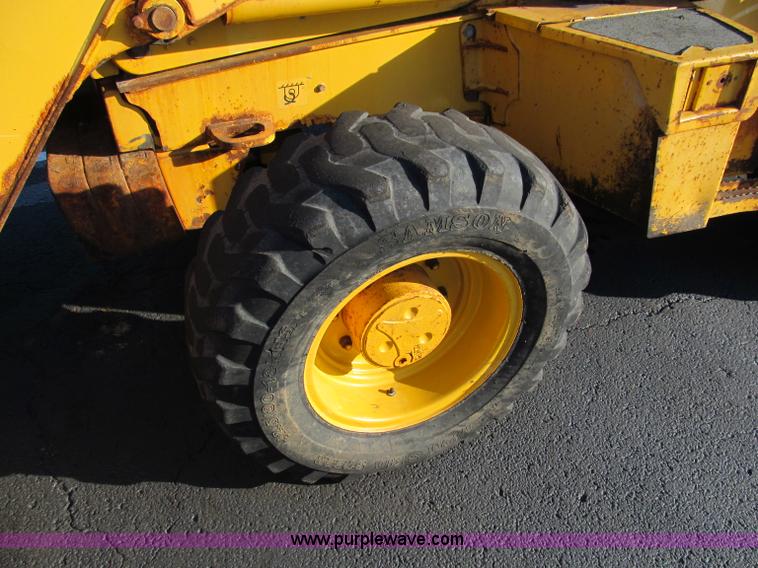 image for item E5643 2003 John Deere 410G backhoe