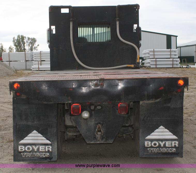 image for item F2643 1999 Peterbilt 330 flatbed semi truck