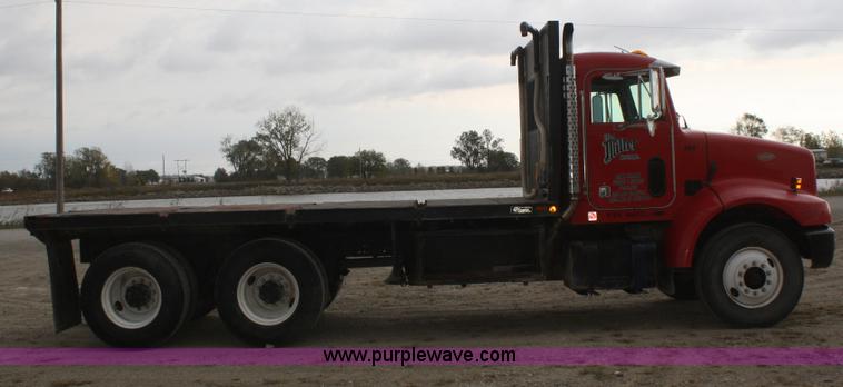image for item F2643 1999 Peterbilt 330 flatbed semi truck