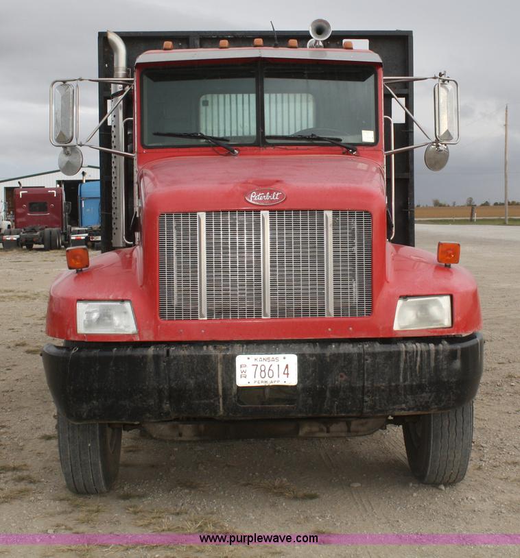 image for item F2643 1999 Peterbilt 330 flatbed semi truck
