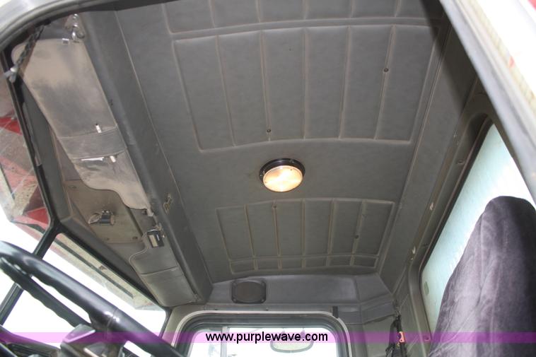 image for item F2643 1999 Peterbilt 330 flatbed semi truck