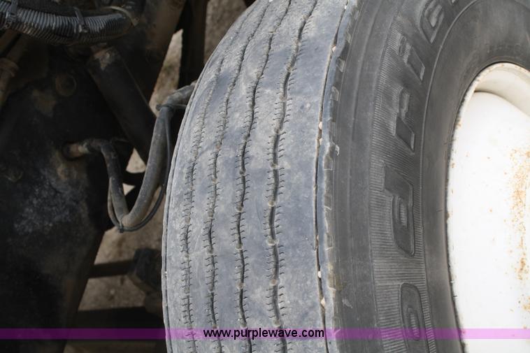 image for item F2643 1999 Peterbilt 330 flatbed semi truck