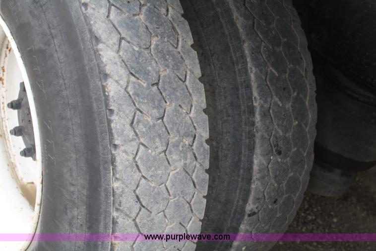 image for item F2643 1999 Peterbilt 330 flatbed semi truck