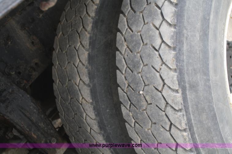 image for item F2643 1999 Peterbilt 330 flatbed semi truck