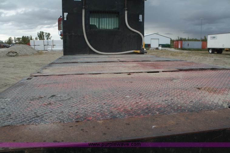 image for item F2643 1999 Peterbilt 330 flatbed semi truck