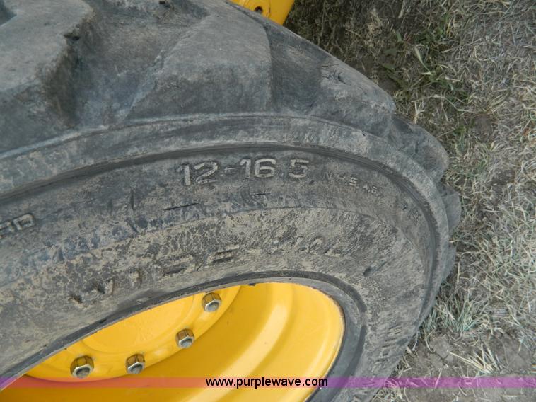 image for item G7518 2006 John Deere 320 skid steer