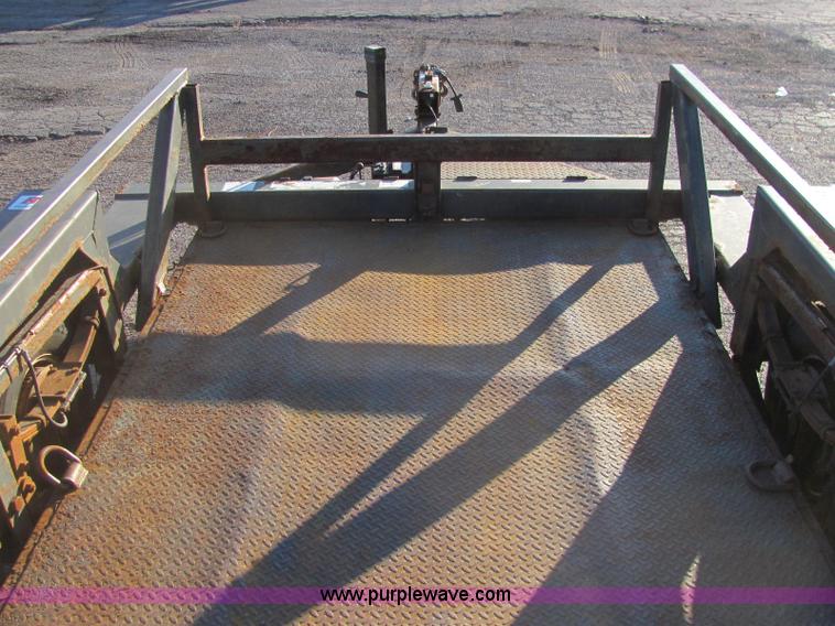 image for item C2939 2004 JLG 7612 tandem axle drop deck flatbed trailer