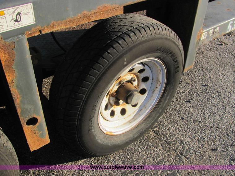 image for item C2939 2004 JLG 7612 tandem axle drop deck flatbed trailer
