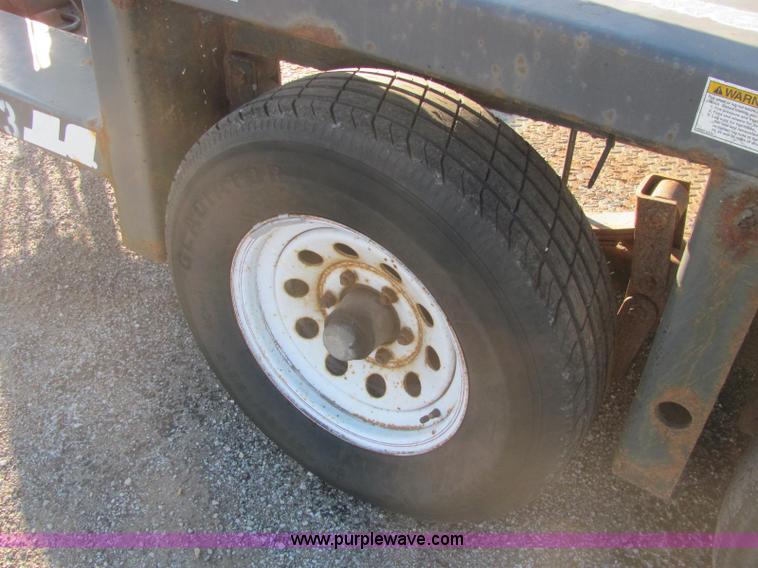 image for item C2939 2004 JLG 7612 tandem axle drop deck flatbed trailer