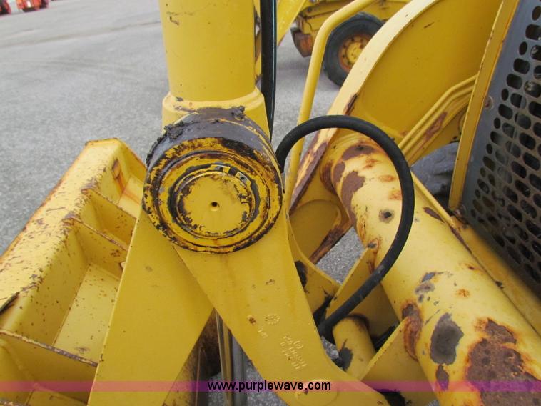 image for item E4167 2003 John Deere 310G backhoe