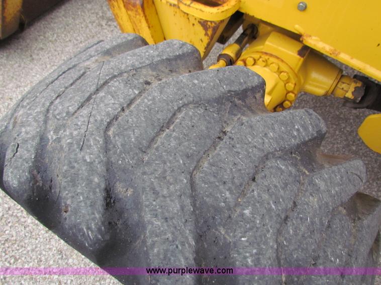 image for item E4167 2003 John Deere 310G backhoe