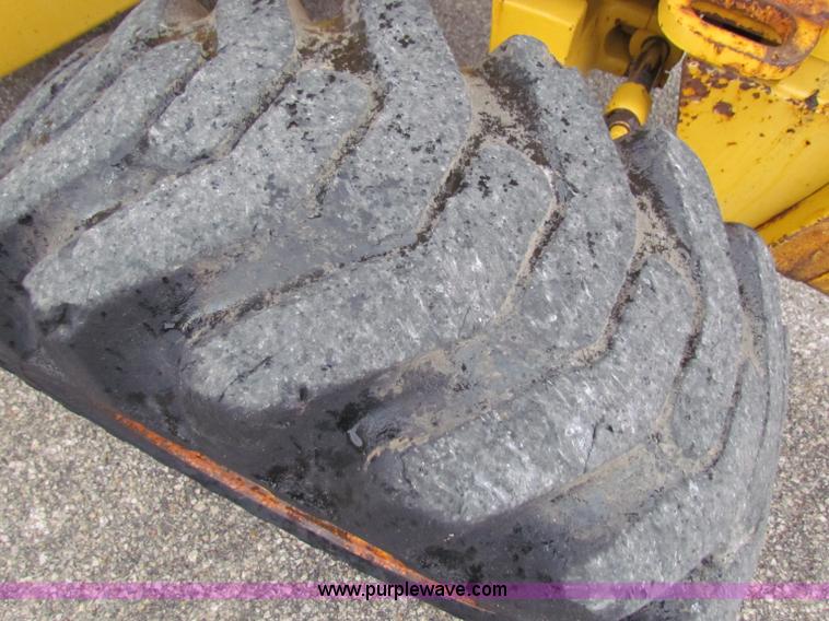 image for item E4167 2003 John Deere 310G backhoe