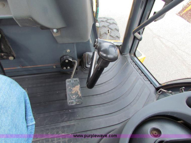 image for item E4168 2004 John Deere 310G backhoe