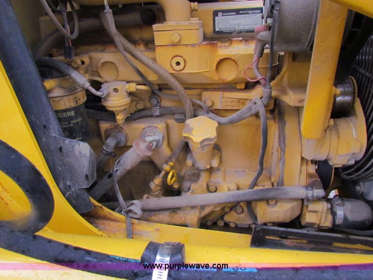 image for item E4168 2004 John Deere 310G backhoe