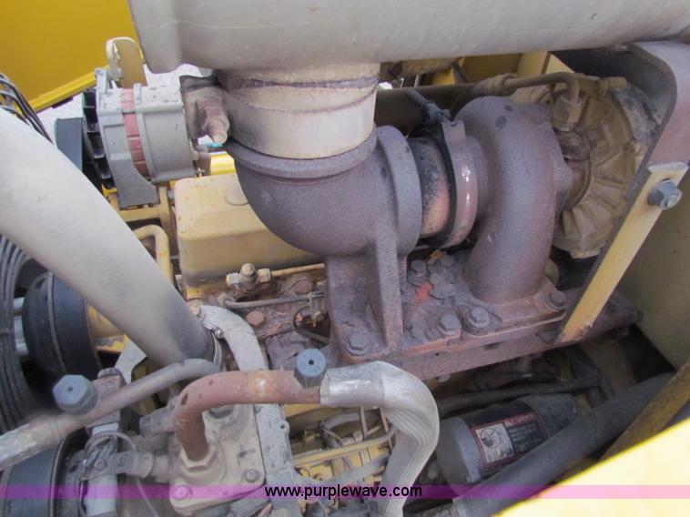 image for item E4168 2004 John Deere 310G backhoe