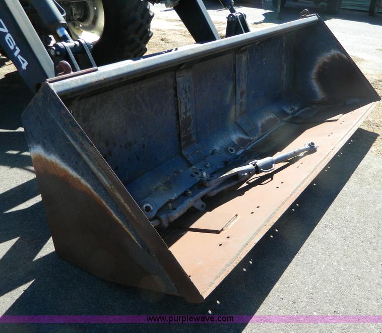 image for item E4189 2000 New Holland TV-140 bi-directional 4WD tractor