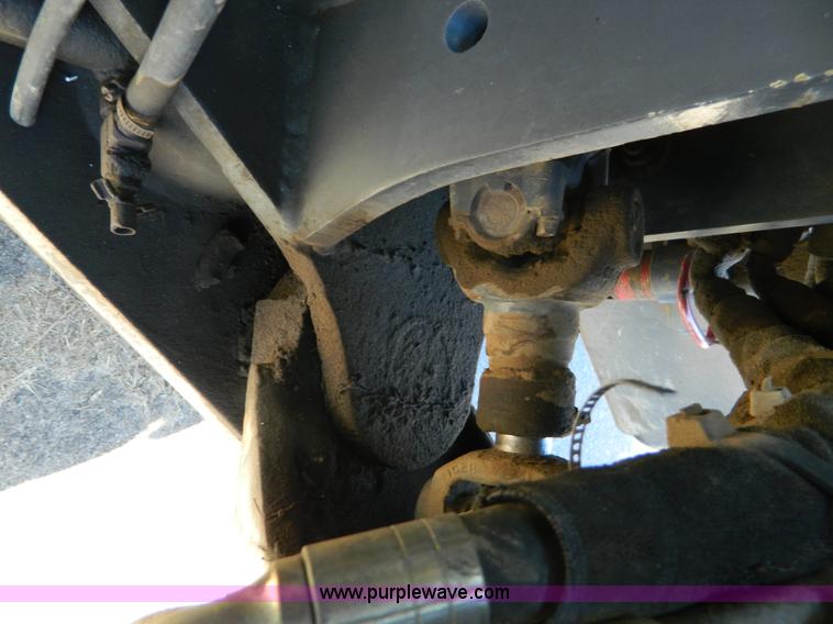 image for item E4189 2000 New Holland TV-140 bi-directional 4WD tractor