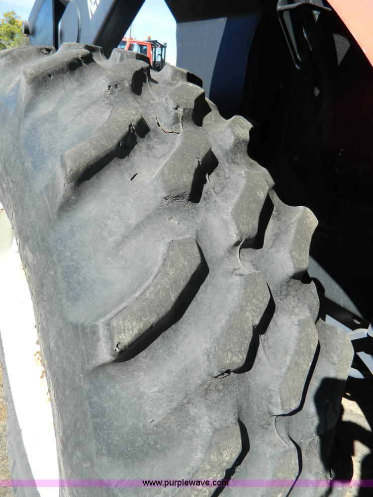 image for item E4189 2000 New Holland TV-140 bi-directional 4WD tractor